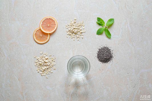 Top down grid of oats citrus slices mint chia seeds and water for a simple morning ritual